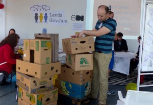 Tom building a prototype using cardboard boxes