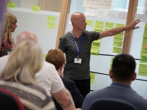 Steve bruce at a show and tell with the PIP Digital Service team