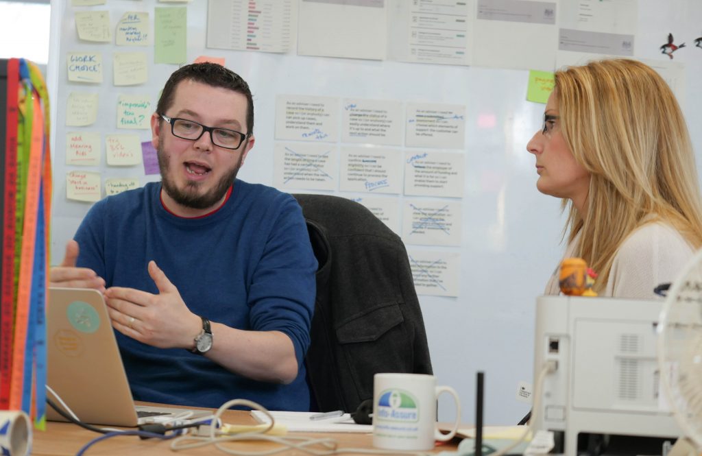 Tom Morgan in DWP's Leeds Transformation Hub with a colleague 