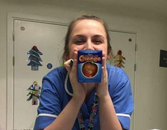 A nurse holds up her chocolate orange