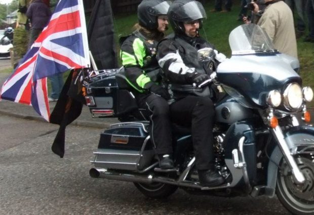 Adam and his wife Claire on their hog