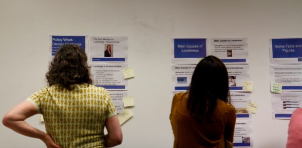 Participants look at the evidence wall during the workshop