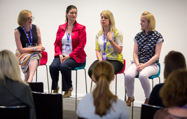 Sue Griffin takes part in a Q&A session with 3 other women at a conference