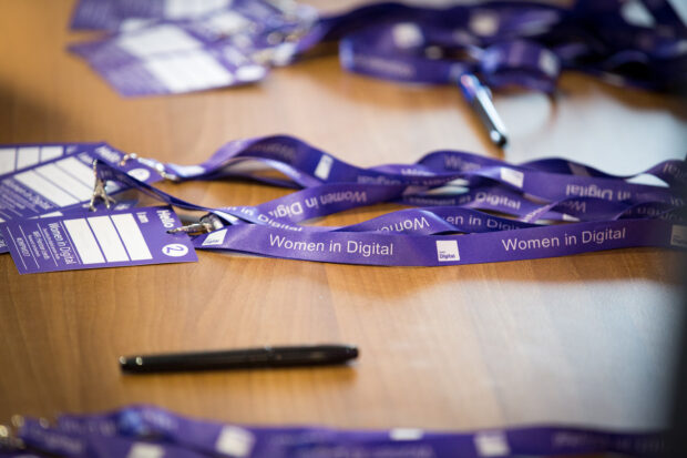 The Women in Digital event lanyard on a desk