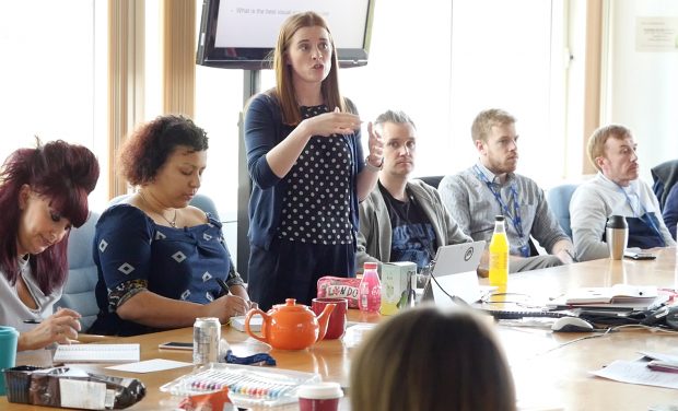 Hayley at a sketch noting lunch and learn in DWP Digital