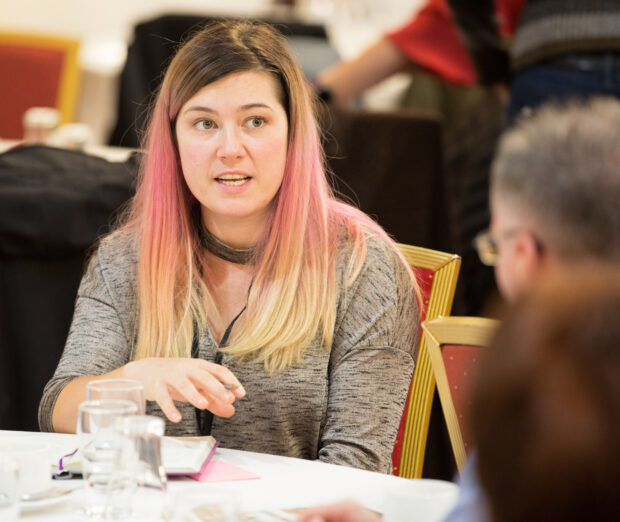 A female delegate talks at an event