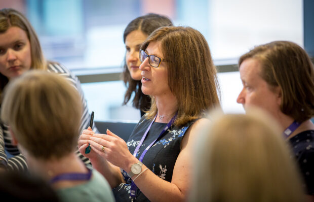 Women discuss digital issues at a conference