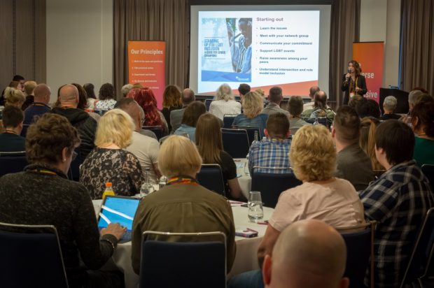 Delegates listen to a keynote from Emma Jennings from Stonewall