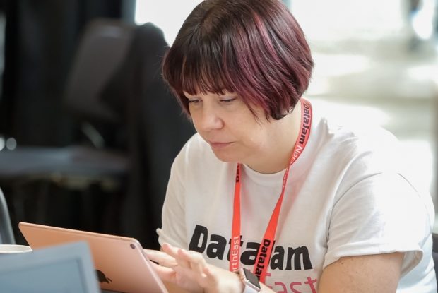 Alyson Atkinson examines data on a laptop computer during the DataJam North East event