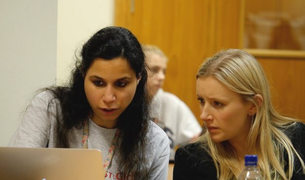 DWP Digital software engineer Pooja Malhotra helps a student during a Code First: Girls session in DWP Digital's Leeds digital hub.