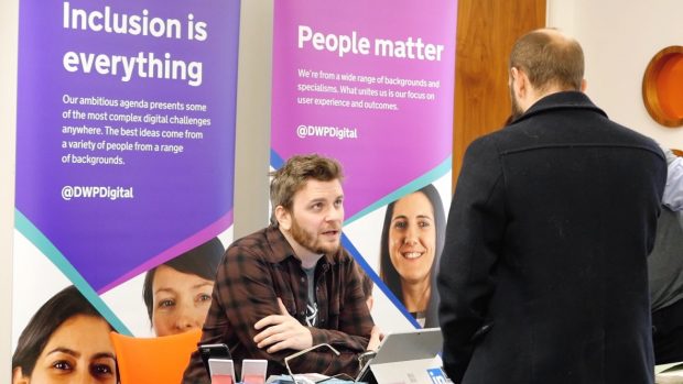 Peter Sweeney discussing recruitment opportunities with someone at the recent Hack the North 2.0 event