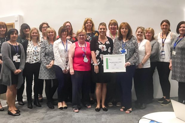 A group of around 20 GAP colleague with their highly commended award certificate