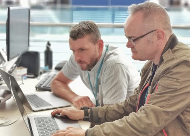 Steve Nelson and Steve Paynter working together at a computer