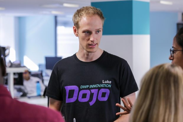 Luke talking with colleagues