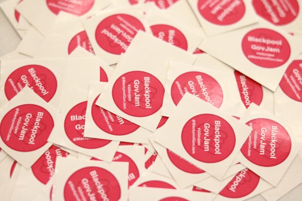 A collection of Blackpool GovJam stickers on a table