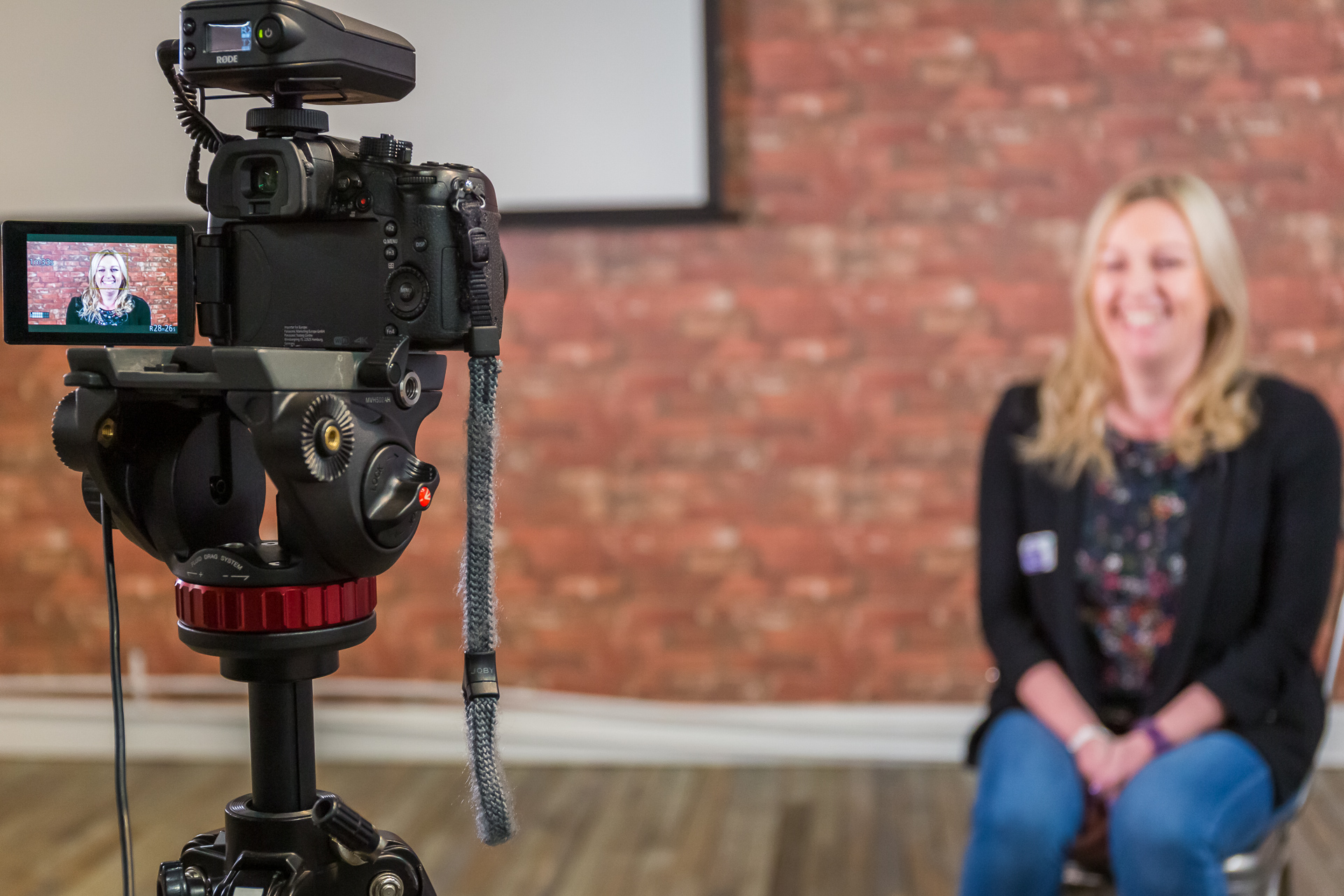 Sara in front of a video camera 