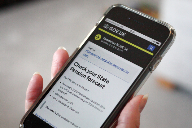 A user views the Check your State Pension forecast page on gov.uk on a mobile phone