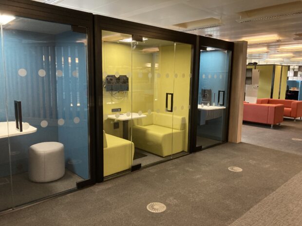 A glass fronted small meeting room in the Newcastle hub test and learn space