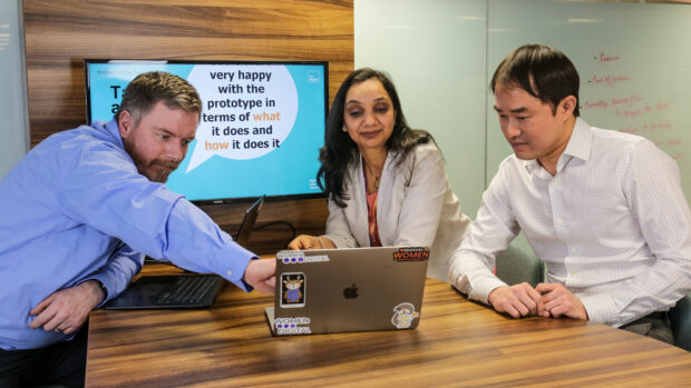 Shruti speaking with colleagues